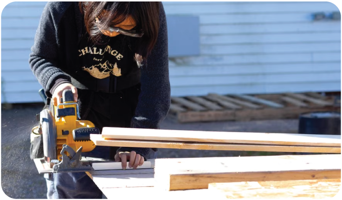 A Contractor Cutting Wood